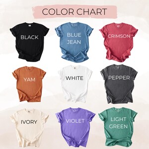May include: Color chart showing 10 different t-shirt colors: black, blue jean, crimson, yam, white, pepper, ivory, violet, light green.