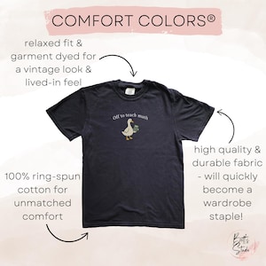 May include: Dark navy blue t-shirt with the text "Off to teach math" and a cartoon goose carrying books. The shirt is made of 100% ring-spun cotton and has a relaxed fit for a vintage look.
