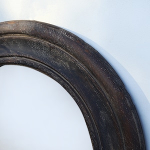 Handcrafted round mirror with a reclaimed teak wood frame and smoky black finish, featuring rounded edges and natural wood character. Rustic wall mirror for bedroom, bathroom, living room or entryway. Reclaimed teak mirror, round wooden mirror, black wood mirror, handmade wall decor, rustic home decor, sustainable wood furniture, artisan-crafted mirror.