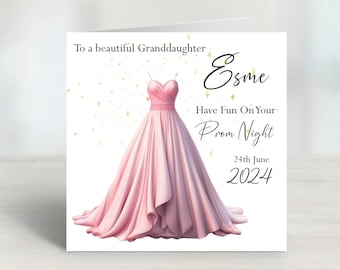Puede incluir: Una tarjeta blanca con una ilustración de un vestido rosa y purpurina dorada. La tarjeta dice "To a beautiful Granddaughter Esme Have Fun On Your Prom Night 24th June 2024".