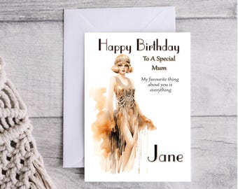 May include: A birthday card with a watercolor illustration of a woman in a flapper dress. The card reads "Happy Birthday To A Special Mum My favourite thing about you is everything Jane"