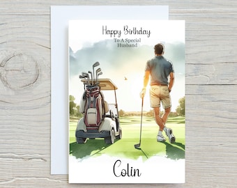 May include: A birthday card with a watercolor illustration of a golfer on a golf course. The card reads "Happy Birthday To A Special Husband" and is personalized with the name "Colin". A golf cart and golf clubs are also visible.