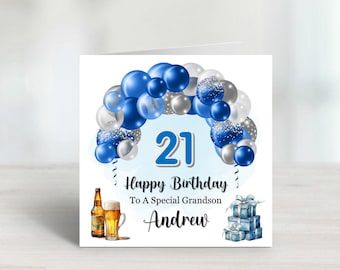May include: A white card with a blue and silver balloon arch, the number 21, and the text "Happy Birthday To A Special Grandson Andrew".