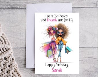 May include: A birthday card with a colorful illustration of two friends holding shopping bags. The card reads "Life is for friends and Friends are for life" and "Happy Birthday Sarah".