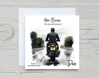 May include: Greeting card with a watercolor illustration of a person riding a motorcycle on a wet road. The card reads "Happy Birthday To A Special Husband" and "Have a wonderful day" with the name "David" at the bottom.