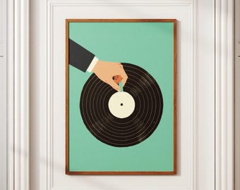 May include: A framed art print featuring a hand in a suit sleeve placing a record on a black vinyl record. The background is a solid teal color. The frame is a dark brown color.