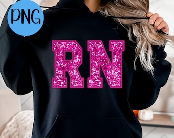 May include: Black hoodie with a pink glitter "RN" design. The hoodie has a drawstring hood and a kangaroo pocket.