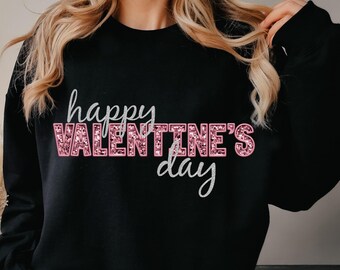 May include: Black sweatshirt with the text "happy VALENTINE'S day" in pink glitter lettering.