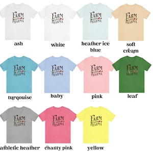 May include: A collage of 12 t-shirts in different colors, each featuring the text "FARM OVER PHARMA" in black with a small graphic of a farm scene. The t-shirts are displayed in rows of four, with the colors ash, white, heather ice blue, soft cream, turquoise, baby blue, pink, leaf, athletic heather, charity pink, and yellow.