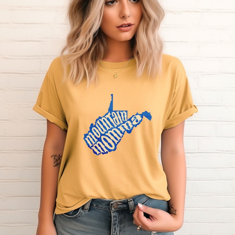 May include: A yellow t-shirt with a blue outline of the state of West Virginia. The words "mountain momma" are written inside the state outline.