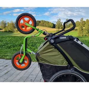 Practical bicycle and balance bike holder for Thule bicycle trailers - worry-free transport for children's vehicles