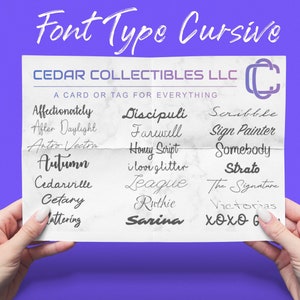 May include: A white sheet of paper with a list of cursive font names written in black ink. The paper is folded in half and held by two hands. The text at the top of the paper reads "Font Type Cursive" and "CEDAR COLLECTIBLES LLC".
