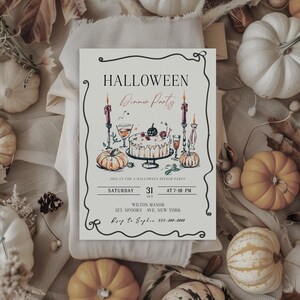 May include: A Halloween dinner party invitation with a watercolor illustration of a cake, candles, and pumpkins. The invitation includes the date, time, and location of the party. RSVP to Sophi 555-000-0000.
