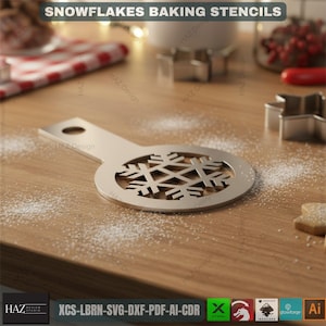 May include: A silver snowflake baking stencil with a handle, lying on a wooden surface dusted with flour. The stencil has a circular design with a snowflake cutout. The text "SNOWFLAKES BAKING STENCILS" is at the top.