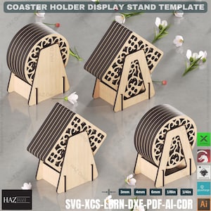 May include: A set of three wooden coaster holders with intricate cut-out designs. Each holder can display six coasters, which are also included in the set. The coasters are brown with a black and white striped pattern. The holders are made of natural wood and have a light brown finish. The image includes the text "SVG-XCS-LBRN-DXE-PDF-AI-CDR".
