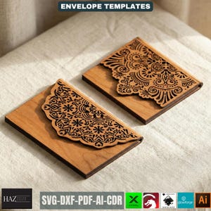 May include: Two wooden envelope templates with intricate black laser-cut designs. The templates are rectangular with a decorative, scalloped edge. The text "ENVELOPE TEMPLATES" is at the top. The bottom of the image shows file type compatibility.