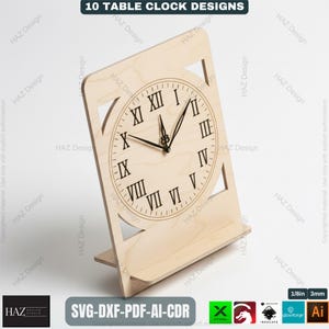 May include: A wooden table clock with Roman numerals and a stand. The clock face is circular, and the hands are black. The clock is made of light-colored wood. The text "10 TABLE CLOCK DESIGNS" is at the top.