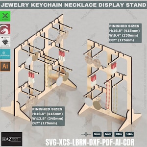 May include: Wooden display stand for jewelry, keychains, and necklaces. The stand has two sections, each with multiple hooks and shelves. The stand is 16.6 inches tall, 13.8 inches wide, and 7 inches deep. The stand is made of wood and has a natural finish.