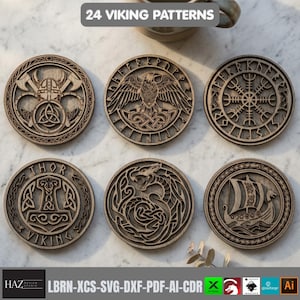 May include: Six circular wooden coasters featuring intricate laser-cut Viking designs, including a helmet with axes, a raven, a compass, Thor's hammer, a serpent, and a longship. The text 24 VIKING PATTERNS is displayed at the top of the image.