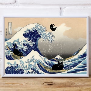 May include: A framed print depicting a whimsical parody of Hokusai's 'The Great Wave off Kanagawa.' The artwork features black cats in boats navigating the iconic wave, with a cat leaping in the air. The color palette includes blues, beige, and black.