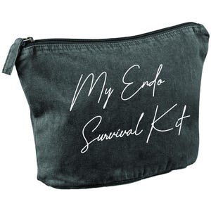 May include: A dark gray zippered pouch with the text "My Endo Survival Kit" in white script. The pouch is made of a soft, textured material and has a black zipper.