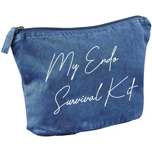 May include: A blue denim-style cosmetic bag with a zipper closure. The bag features the white script text "My Endo Survival Kit". The bag is designed to hold personal care items.