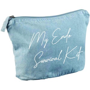 May include: A light blue denim-style zippered pouch with the text "My Endo Survival Kit" in white script. The pouch has a rectangular shape with a curved top and a silver zipper.