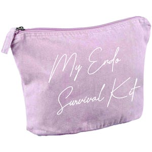 May include: A light purple canvas cosmetic bag with a zipper closure. The bag has the words "My Endo Survival Kit" printed in white script across the front. The bag is designed to hold personal care items.
