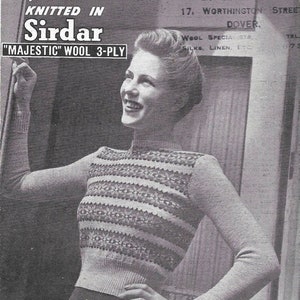 May include: A black and white photo of a woman wearing a striped sweater with a high neckline. The sweater is knitted in "Sirdar" "Majestic" wool 3-ply. The photo is from a knitting pattern booklet.