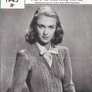 May include: A black and white photo of a woman wearing a knitted cardigan with a cable knit pattern. The cardigan has a V-neck and buttons down the front. The woman is wearing a white blouse underneath the cardigan. The photo is from a vintage knitting pattern from 1943. The text on the photo reads "BESTWAY SUSAN SHAW'S CARDIGAN 1943 3d. (MEDIUM SIZE) 8 ozs. of W.B. Melody Knitting Wool, 3-ply Posed by the lovely star of the J. Arthur Rank Organisation."