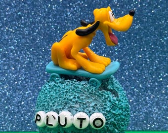 Pluto on skateboard on 3" sphere