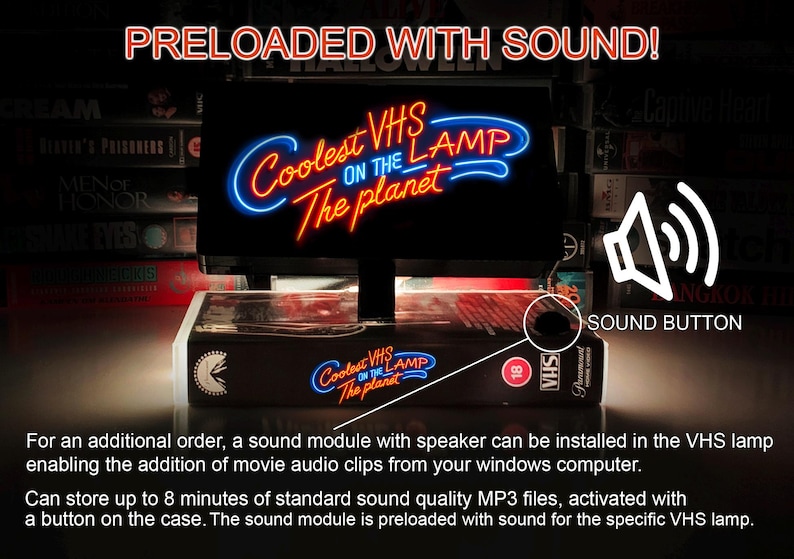 May include: A black VHS lamp with a neon sign that reads "Coolest VHS on the Lamp The Planet". The lamp is sitting on top of a stack of VHS tapes. A white speaker icon with the text "Sound Button" is in the upper right corner of the image. The lamp has a button on the side to activate the sound module.
