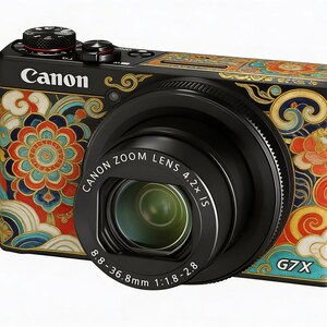 May include: Black Canon G7X digital camera with a decorative floral pattern in red, blue, and gold. The camera lens is black, and the text "Canon Zoom Lens 4.2x IS" is visible. The camera also has the text "G7X".