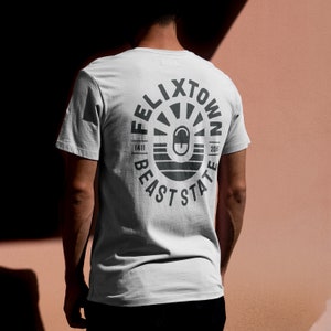 Felixtown Graphic Tee | Bold Black Print Unisex T-Shirt | Seaside-Inspired Streetwear | Eco-Friendly Artist Design