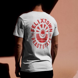 Felixtown Graphic Tee | Bold Red Print Unisex T-Shirt | Seaside-Inspired Streetwear | Eco-Friendly Artist Design