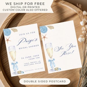 May include: Two-sided bridal shower postcard with a beach theme. The front features the text "Paige's Bridal Shower" with event details and a champagne glass illustration. The back says "See You There!" with a champagne glass.