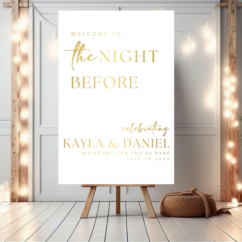 May include: White sign with gold lettering announcing "Welcome to the Night Before celebrating Kayla & Daniel We're so glad you're here July 19, 20XX"