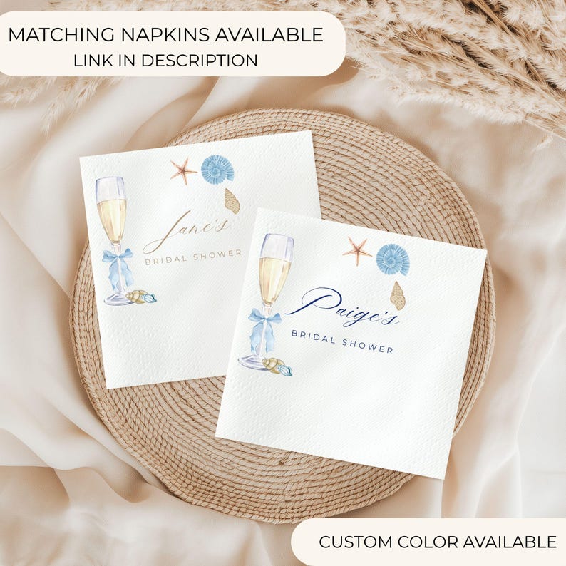 Puede incluir: Dos servilletas de papel blancas con ilustraciones de acuarela para una despedida de soltera. Cada servilleta presenta una copa de champ&aacute;n con un lazo azul, conchas marinas y el texto "Jane's Bridal Shower" y "Paige's Bridal Shower". El texto "Matching Napkins Available Link in Description" est&aacute; en la parte superior.