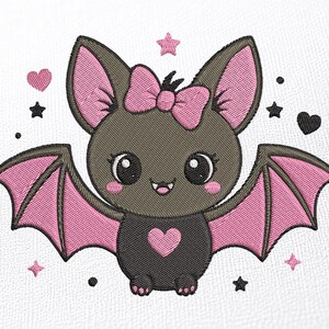 May include: An embroidered design of a dark gray bat with large eyes, pink cheeks, and a pink bow on its head. The bat has pink-lined wings and a pink heart on its chest, surrounded by small pink hearts, black stars, and black dots on white fabric.