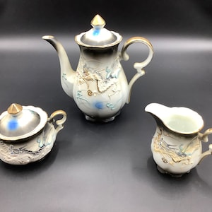 Vintage moriage dragon ware tea set. Five piece - Teapot, creamer and sugar bowl