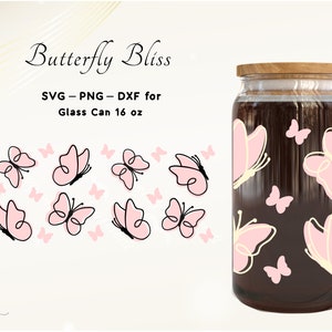 May include: A glass jar with a wooden lid, decorated with a pink butterfly pattern. The jar is 16 ounces and has the text "Butterfly Bliss" and "SVG - PNG - DXF for Glass Can 16 oz" on the label.