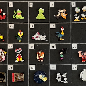 May include: Collection of colorful character pins featuring a red fox, Kermit the Frog, Chip and Dale, Donald Duck, a dragon, a rooster, a rabbit, and more. Includes pins with text.