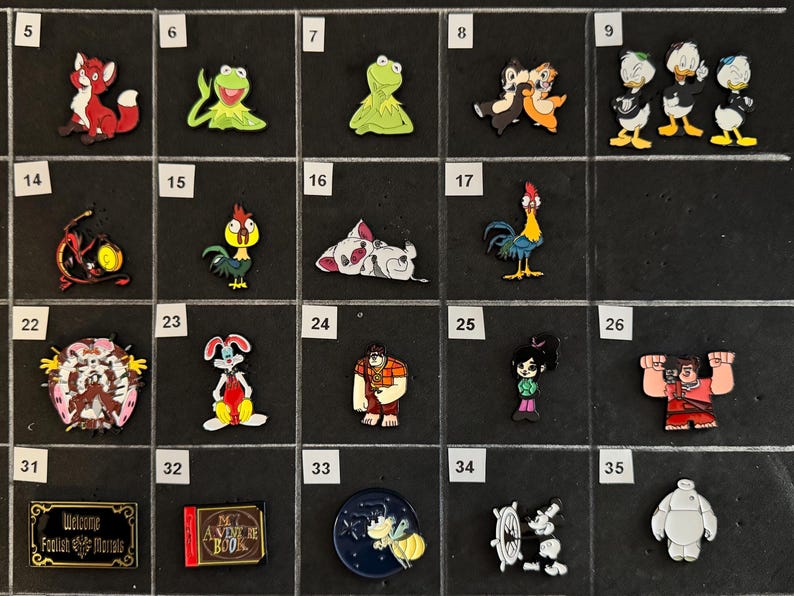 May include: Collection of colorful character pins featuring a red fox, Kermit the Frog, Chip and Dale, Donald Duck, a dragon, a rooster, a rabbit, and more. Includes pins with text.