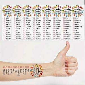 May include: Eight colorful temporary tattoos with the text "Drinking Around the World" and a checklist of countries to mark off as you drink. The countries listed are USA, Norway, Mexico, Germany, Italy, UK, Japan, Morocco, Canada, and France.