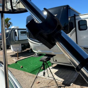 May include: A white ceramic mug with a black handle and the text "But First, Coffee" in a black, bold font. The mug is sitting on a wooden surface. The mug is approximately 4 inches tall.