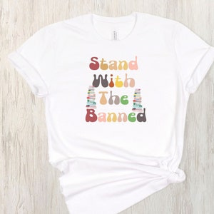 Stand With The Banned, Banned Books Shirt, Read Banned Books, Unisex Soft Graphic T-Shirt, Reading Shirt. Librarian Shirt. Teacher Shirt