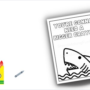 May include: A black and white coloring page featuring a shark with the text "You're gonna need a bigger crayon".