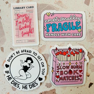 May include: Four stickers with various designs. One is a pink library card with the text "Sorry, I'm fully booked tonight!". Another is a pink sticker with "emotionally FRAGILE HANDLE WITH CARE". A third sticker says "DON'T BE AFRAID TO GET ON TOP IF HE DIES, HE DIES". The last sticker is a pink matchbox with "SLOW BURN BOOK MATCHES".
