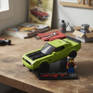 May include: A lime green toy car with black racing stripes and black wheels is displayed on a black stand with the text "DODGE SRT". A Lego figure of a mechanic stands next to the car. The car is on a wooden surface.