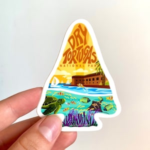May include: A yellow, orange, and blue sticker with the text "Dry Tortugas National Park" and a depiction of a fort, a sea turtle, and fish.